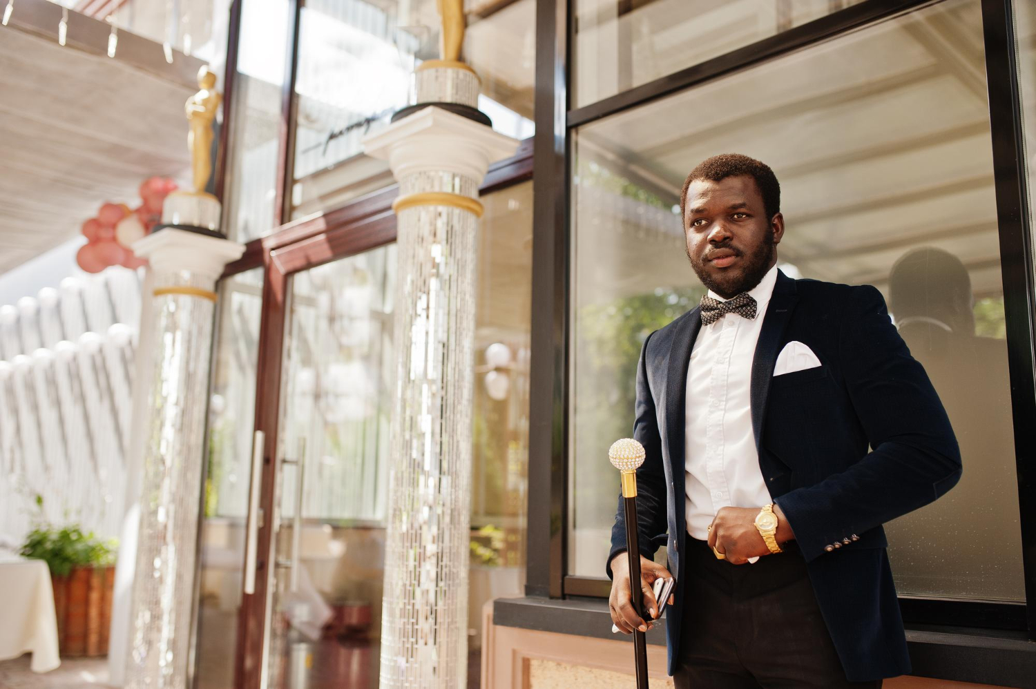 handsome-fashionable-african-american-man-formal-wear-bow-tie-with-walking-stick