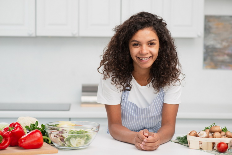 smiling-afro-american-woman-posing-vegetables_resize